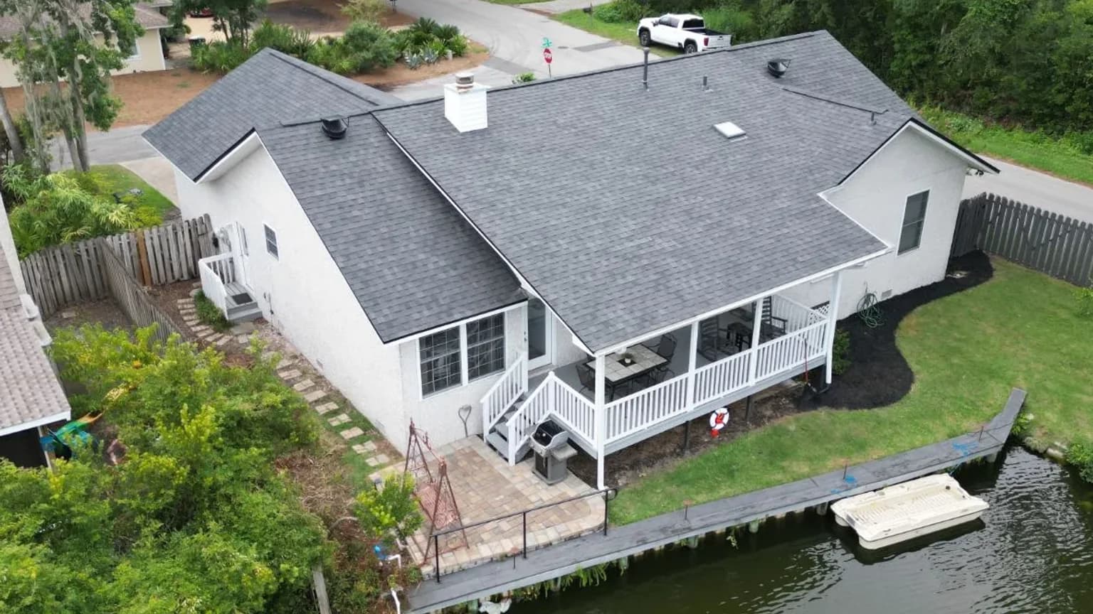 Drone view of a completed asphalt shingle roof in Savannah with roof-mounted exhaust vents