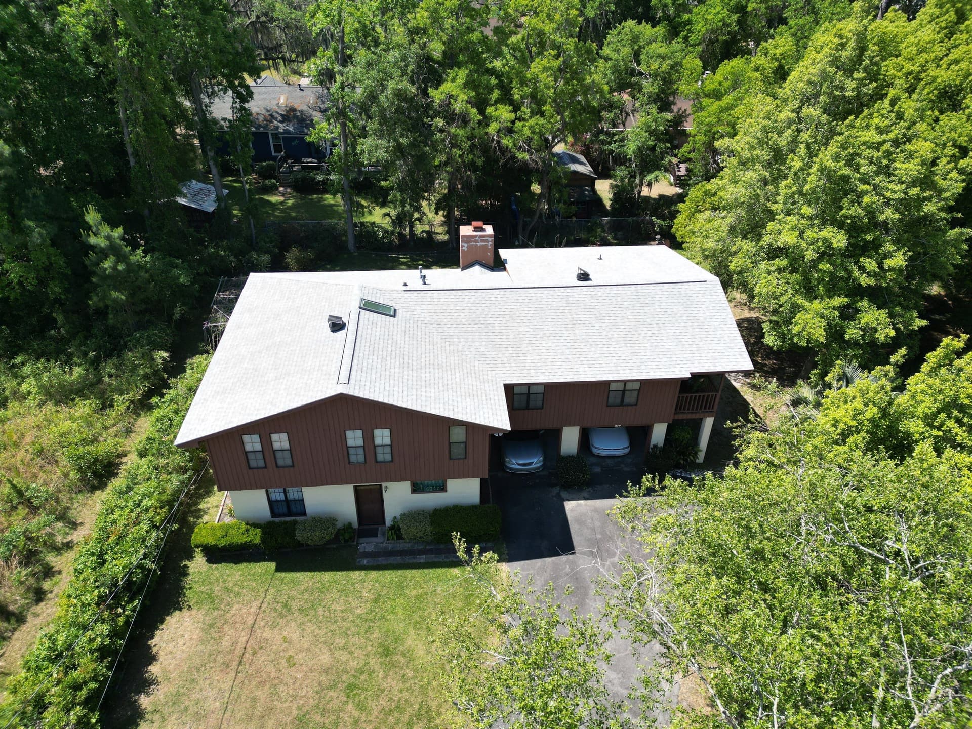 Aerial angle two of completed Oyster Shell roof replacement