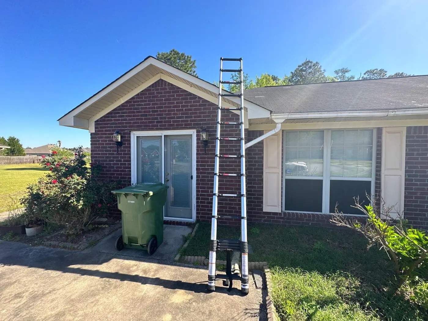 Hinesville brick home with its existing 3-tab shingle roof before replacement.