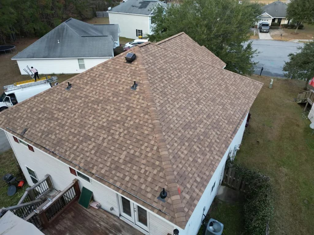 Talya Roofing team working on residential roof in Savannah
