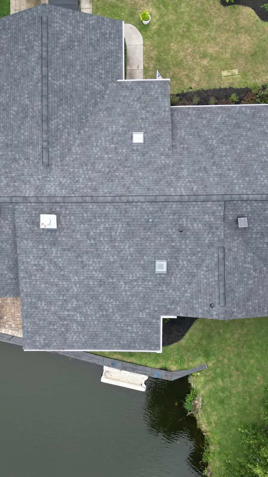 Talya Roofing roof replacement project in Coastal Georgia showing a new architectural shingle roof installed on a waterfront home