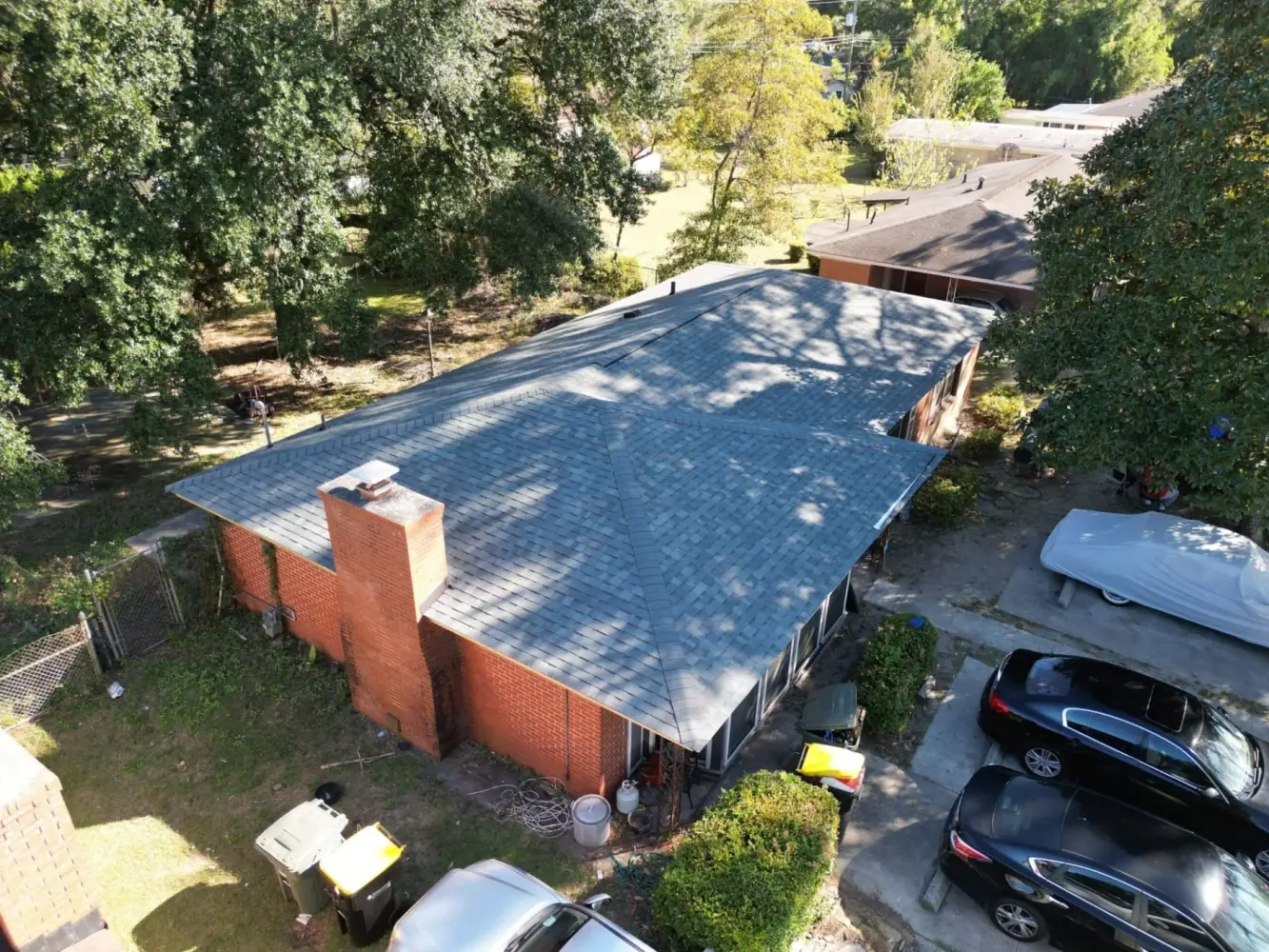 Complete roof renovation with Owens Corning Oakridge Estate Gray shingles on modern home in Sylvan Terrace Savannah Georgia