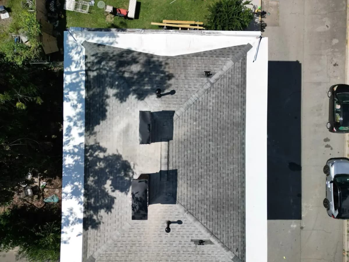 Two-story historic home TPO roof repair and chimney restoration in Savannah Historic District Georgia by Talya Roofing