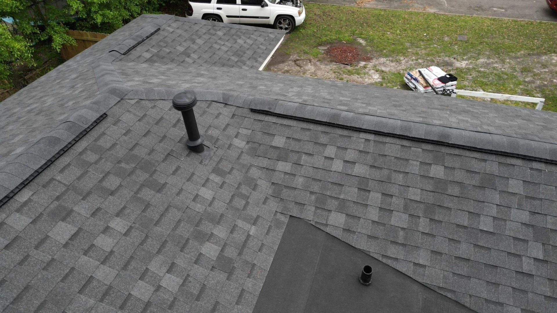 Click to view Premium Dimensional Shingles - Aerial View - Professional Residential Roofing project in Savannah, GA Aerial view of premium GAF Timberline HDZ Storm Gray dimensional shingles on residential home in Savannah GA, showcasing professional roofing installation with clean lines and expert craftsmanship by Talya Roofing contractors - Image 1